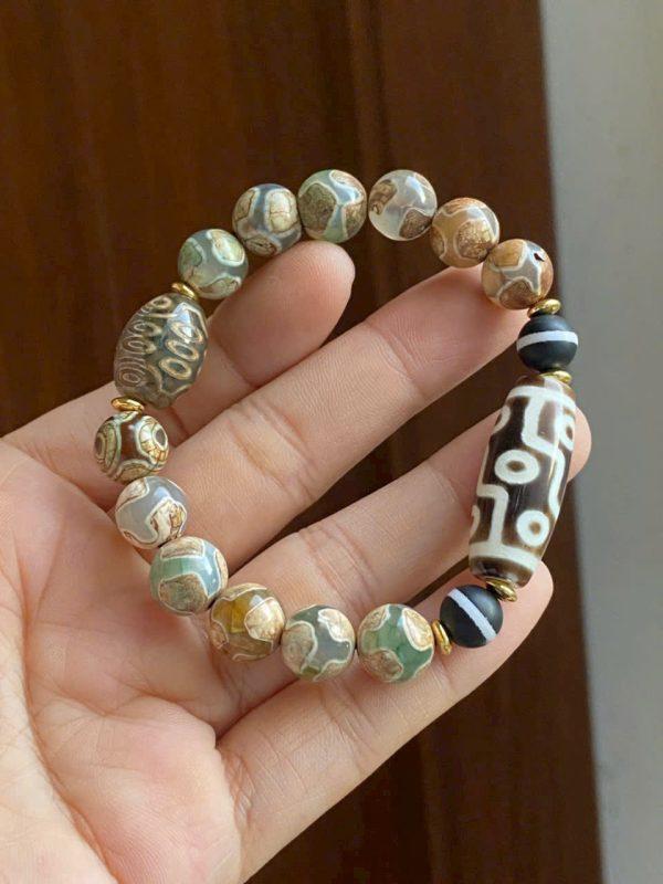 Dzi 9 mắt thân nâu thấu quang kết hợp dzi thân ngọc xanh