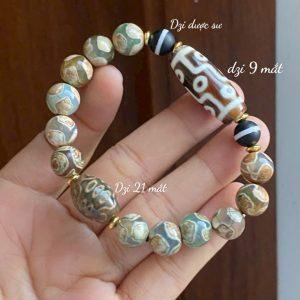 Dzi 9 mắt thân nâu thấu quang kết hợp dzi thân ngọc xanh