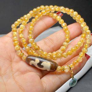 Chuỗi thạch anh tóc vàng mix dzi như ý + cham điếu ngọc hoa bay