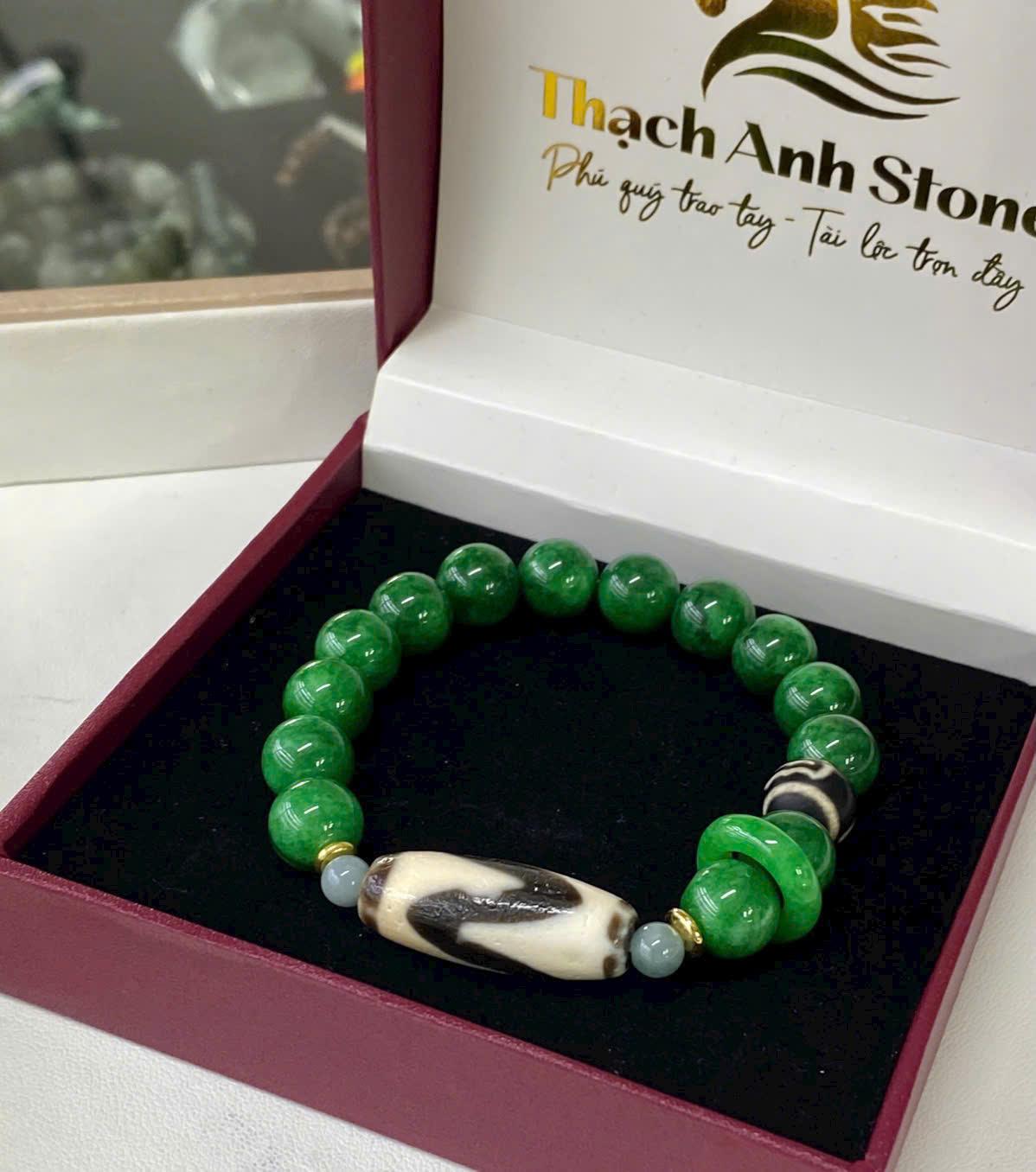 z7115715185860_7b1b04065229c1ce8f16155f7f1e2cfb Vòng tay Dzi nanh cọp mix cẩm thạch 10li – Sức mạnh, may mắn và đẳng cấp hội tụ