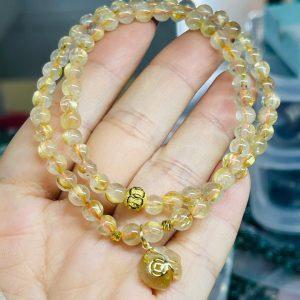 Thạch anh tóc vàng quấn mix charm túi tiền lên vàng non