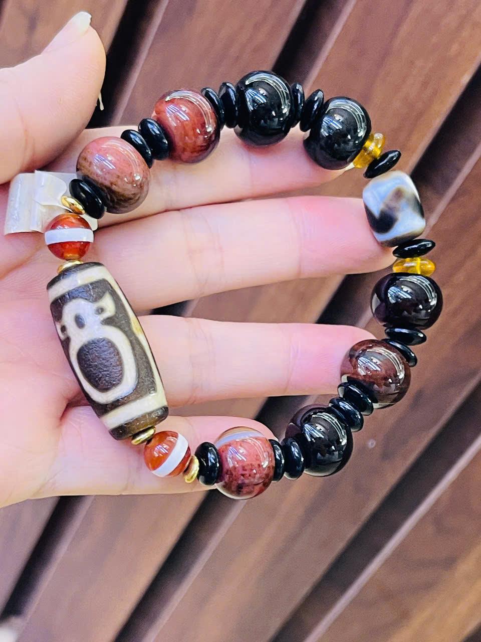 z7177937412960_f701f04d79cdd342c3f731f870067ccf vòng tay Dzi Thần Tài