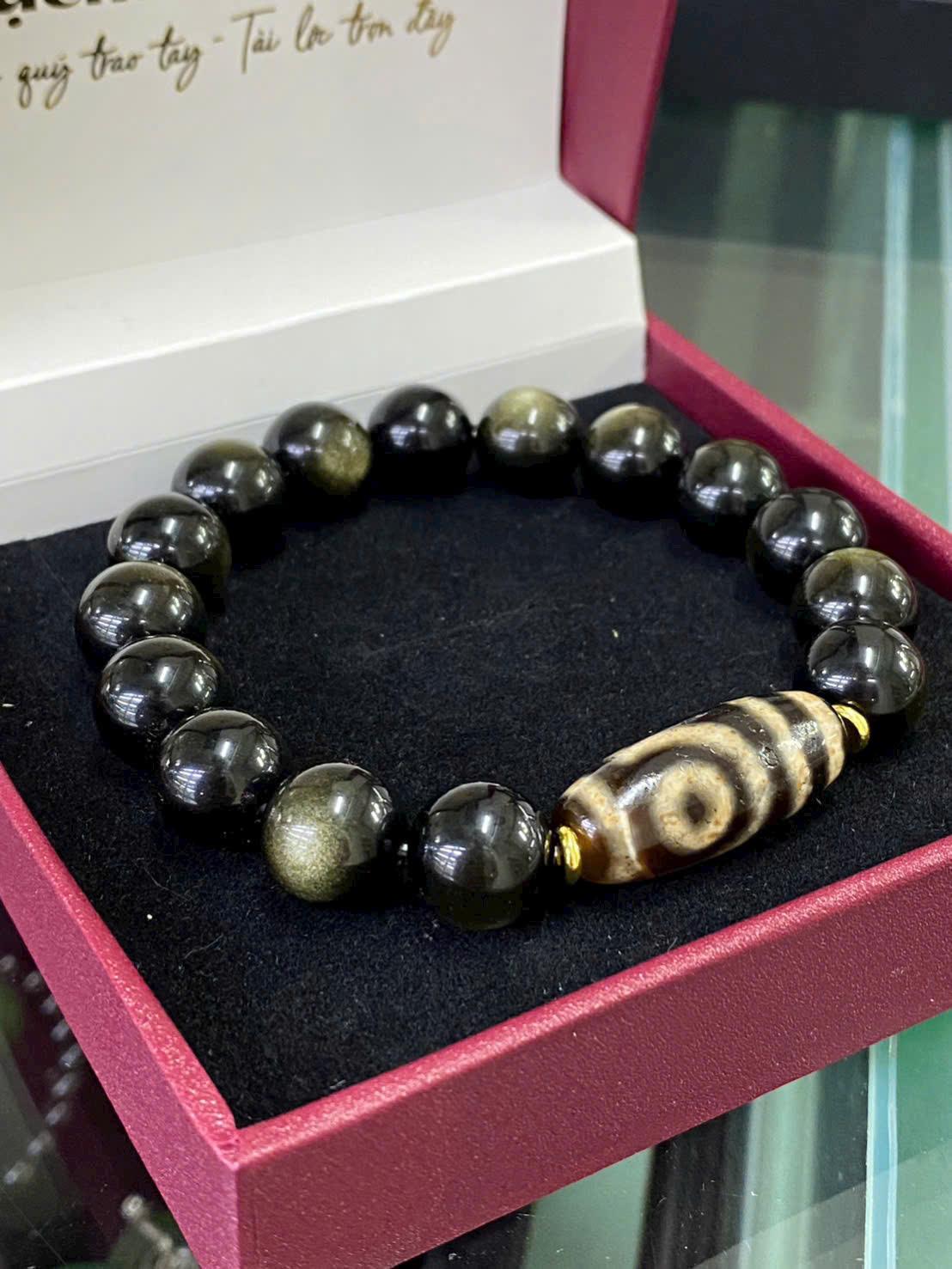 z7181989380917_e80be1acee5e388a4f836d50a0921387 Vòng tay Obsidian ánh xà cừ mix dzi 2 mắt thấu quang