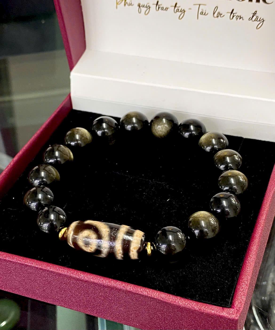 z7181989391731_1fa94c3ad27cd95521fe848b58e546a0 Vòng tay Obsidian ánh xà cừ mix dzi 2 mắt thấu quang