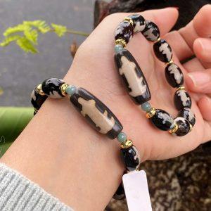 Vòng dzi Quan âm thân nâu B7250A1