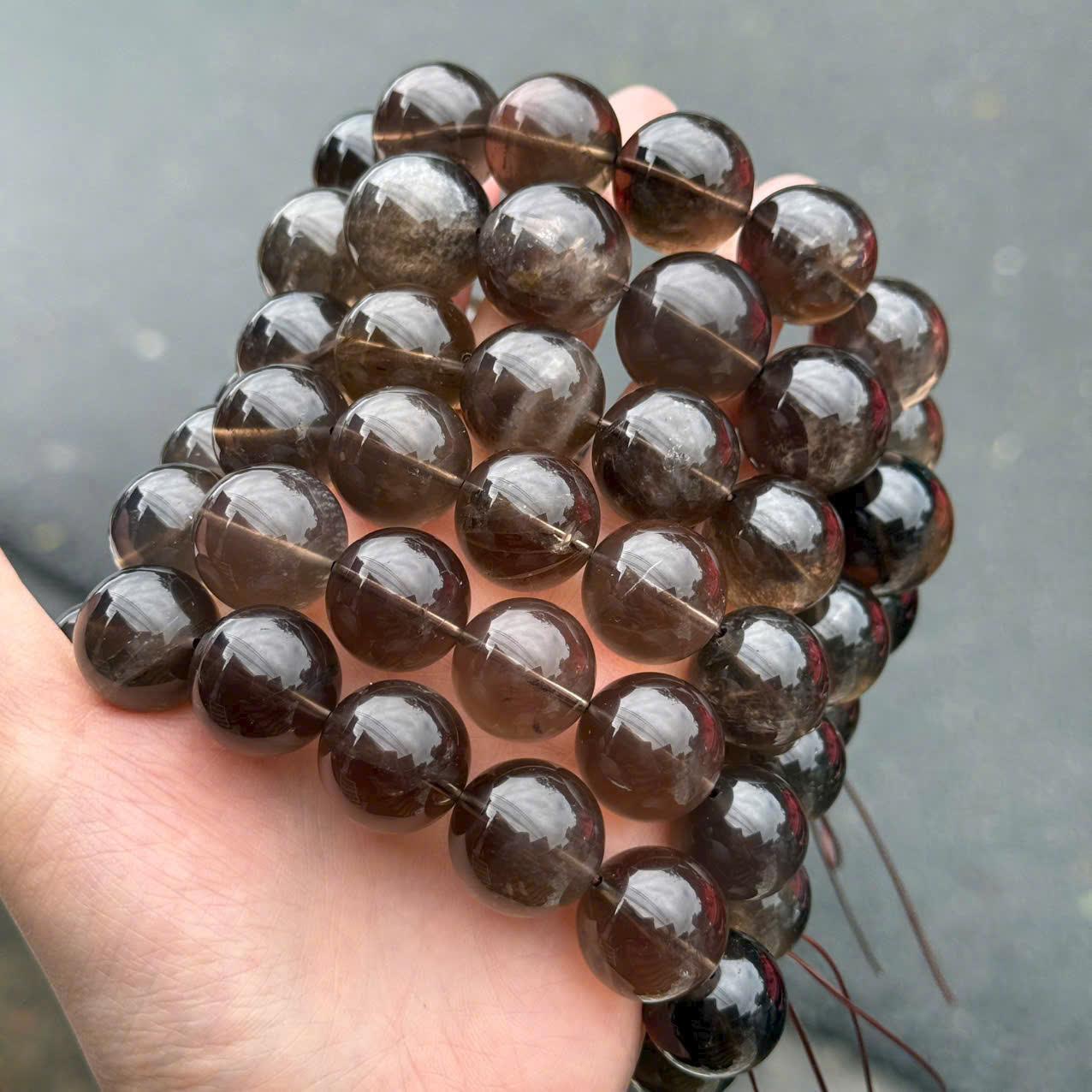 z7257203721117_e7f2a9bf6abf25c16b6a7c4222065bc4 Vòng tay thạch anh khói 17-18-20-21mm