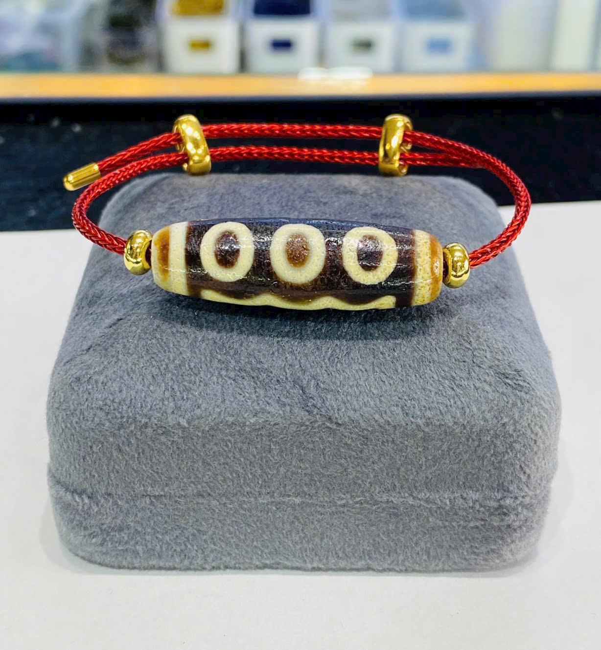 z7328718705497_ac83cc4d3c7d93cc79018ce68076f4f9 Vòng tay lên dây cáp Cụ Dzi 5 mắt thân nâu lên vảy